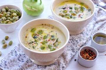 Kohlrabi cream soup with fried broad beans. A healthy vegetarian meal