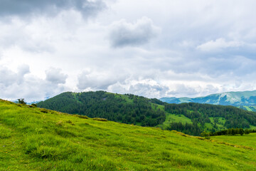 A picturesque landscape view of the French Alps mountains on a cloudy summer day (Valberg, Alpes-Maritimes, France)