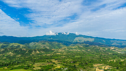 Aerial view of hills, rice fields and tropical forest in Indrapuri, Aceh Besar District, Aceh Province