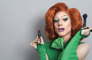 Happy drag queen preparing makeup in studio - LGBTQ concept - obrazy, fototapety, plakaty