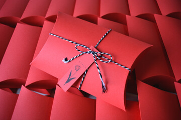 red gift pillow boxes with ribbon