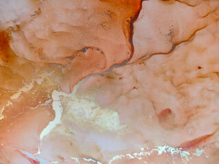 Background texture of alcohol ink in red color.  Abstract fire paint with drops and stains.