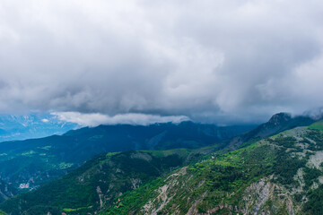 A picturesque landscape view of the French Alps mountains on a cloudy summer day (Valberg, Alpes-Maritimes, France)