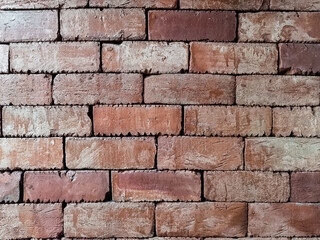 Brown brick wall. Texture of brown brick wall pattern background. Abstract wallpaper texture with old and vintage style pattern. Home or office design backdrop. Outstandingly beautiful architecture.