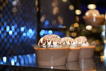 chocolate dessert cake with sprinkles on the table