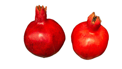 Whole two red pomegranates isolated on white background. Garnet is a symbol of Judaism, fertility and abundance.
