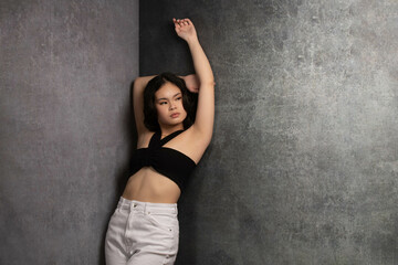 Fashionable Asian Girl on Grey Background