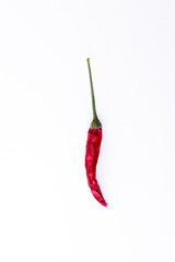 one red chili pepper isolated on a white backdrop close-up macro, top view