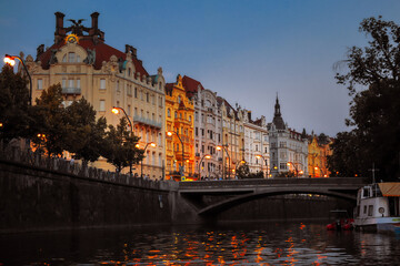 prague street view from Vltava river at sunset golden hour