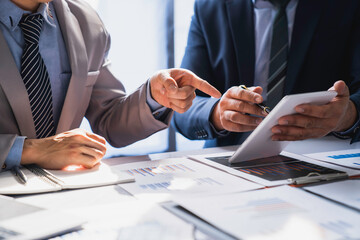 Business team working on new startup projects. Discuss the analysis of charts and graphs showing investment performance reports. and profit accounting and finance business ideas