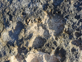 Coast of the Mediterranean Sea, long frozen lava. Background. It looks like an alien landscape.