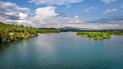 Fototapeta premium Magnificent view of the Sharavathi river with nice blue sky bacground.