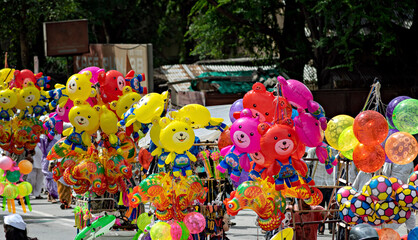 Fototapeta premium Colorful, smiling air filled balloon toys for sell in holy procession of Pandharpur Palkhi