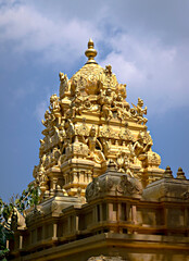 Fototapeta na wymiar Intricately carved golden dome of famous Tirupati temple in Andhra Pradesh, India