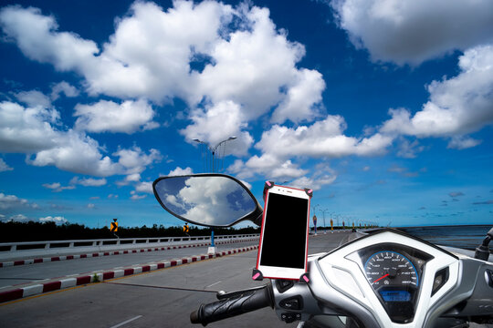 Smartphone on motorcycle handlebar holder for safety and use it to view the navigation map