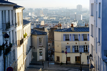 Roofs of Paris and old street in the Butte Montmartre. 18 th arrondissement of Paris city          ...