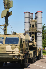 military complex anti-aircraft missile system. weapons of mass destruction against the blue sky with communication antenna and radar