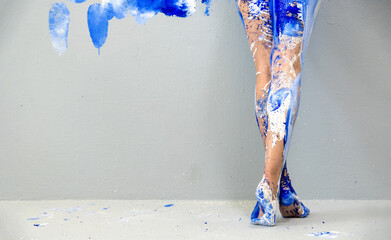 panoramic view to beautiful legs and feet on tiptoe of a sexy young artistically abstract painted...