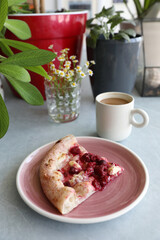 Dessert pizza with raspberries in a plate on the table