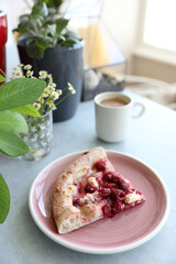 Dessert pizza with raspberries in a plate on the table