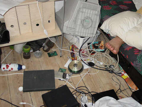 Student Digs - Lifestyle - A Teenagers Room. A Candid Image Of A Messy Bedroom With A Foot Sticking Out From Under The Bed Covers.