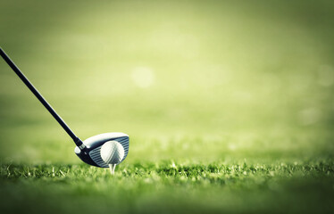 The first drive is vital. A golf club ready to tee-off with a white ball on a golf course.