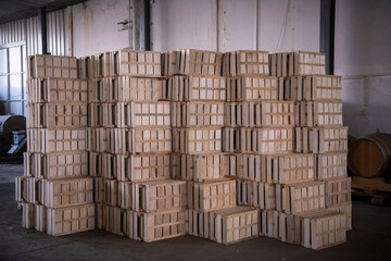 Stack of empty wooden crates or boxes for fruits and vegetables at the market warehouse.