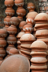 Fototapeta na wymiar Many earthen pots or clay pots are kept for drying in the sun in the workshop.