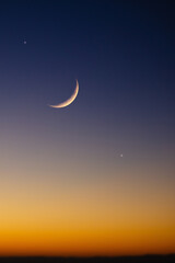 Crescent Moon, stars and planets on evening sky. © astrosystem