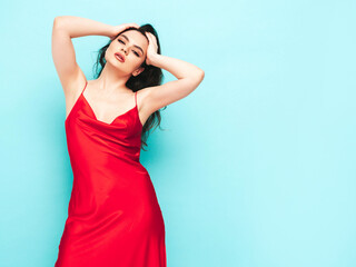 High fashion portrait of young beautiful brunette woman wearing nice trendy red evening dress. Sexy...