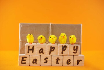 Easter background with cubes, gift and chicks