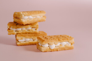 viennese waffles isolated on pink background. Sweet Belgian waffles with toppings on a pink background