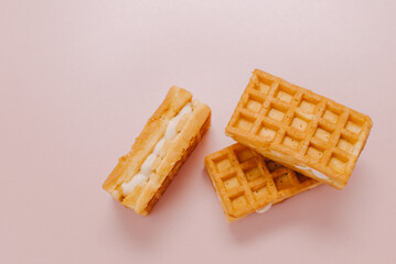 viennese waffles isolated on pink background. Sweet Belgian waffles with toppings on a pink background