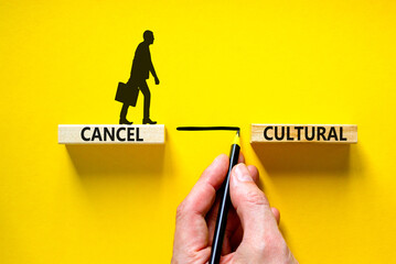Cancel cultural symbol. Concept words Cancel cultural on wooden blocks on a beautiful yellow table...