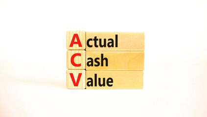 ACV actual cash value symbol. Concept words ACV actual cash value on wooden blocks on a beautiful white table, white background. Business and ACV actual cash value concept. Copy space.