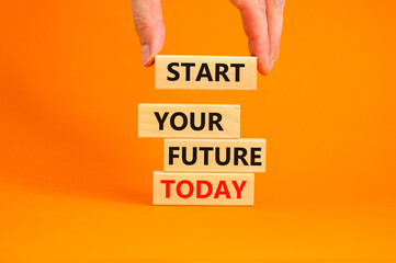 Start your future today symbol. Concept words Start your future today on wood blocks. Businessman hand. Beautiful orange table orange background. Start your future today business concept. Copy space.