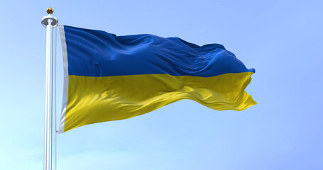 Detail of the national flag of Ukraine waving in the wind on a clear day