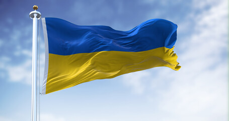 Detail of the national flag of Ukraine waving in the wind on a clear day