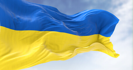 Detail of the national flag of Ukraine waving in the wind on a clear day