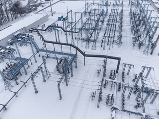 Aerial view of a high voltage electrical substation in winter season.