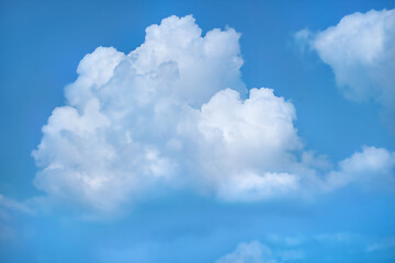Close-up of a bright еnd blue sky with white air clouds.