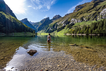 Swimming at the lake Seealpsee in the afternoon - obrazy, fototapety, plakaty