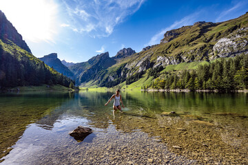 Swimming at the lake Seealpsee in the afternoon - obrazy, fototapety, plakaty