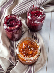 Various jars with homemade fruit jam.