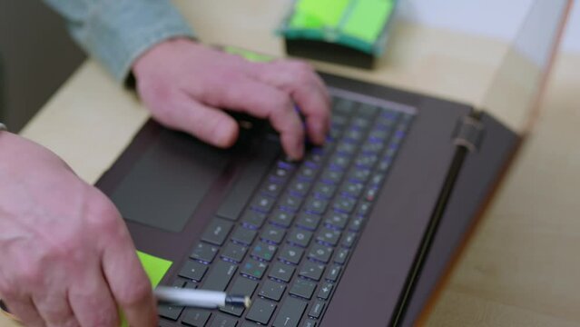 Close up view of man typing on computer keyboard. Sweden.