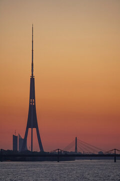 Riga TV Tower, bridges and the Daugava River at sunset