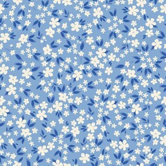 Seamless vintage pattern. Small white flowers and blue leaves. Light blue background. vector texture. fashionable print for textiles, wallpaper and packaging.