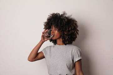 Fototapeta Millennial woman hold glass of water drink mineral aqua for body refreshment. obraz