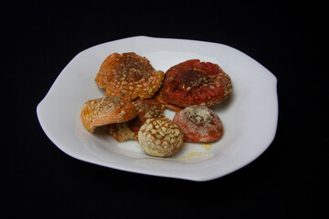 Dried caps of red fly agaric. Treatment with fly agarics