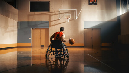 Wheelchair Basketball Player Dribbling Ball Like a Professional, Ready to Shoot and Score Goal. Determination, Motivation of a Person with Disability Excelling at Team Sport. Back View Shot